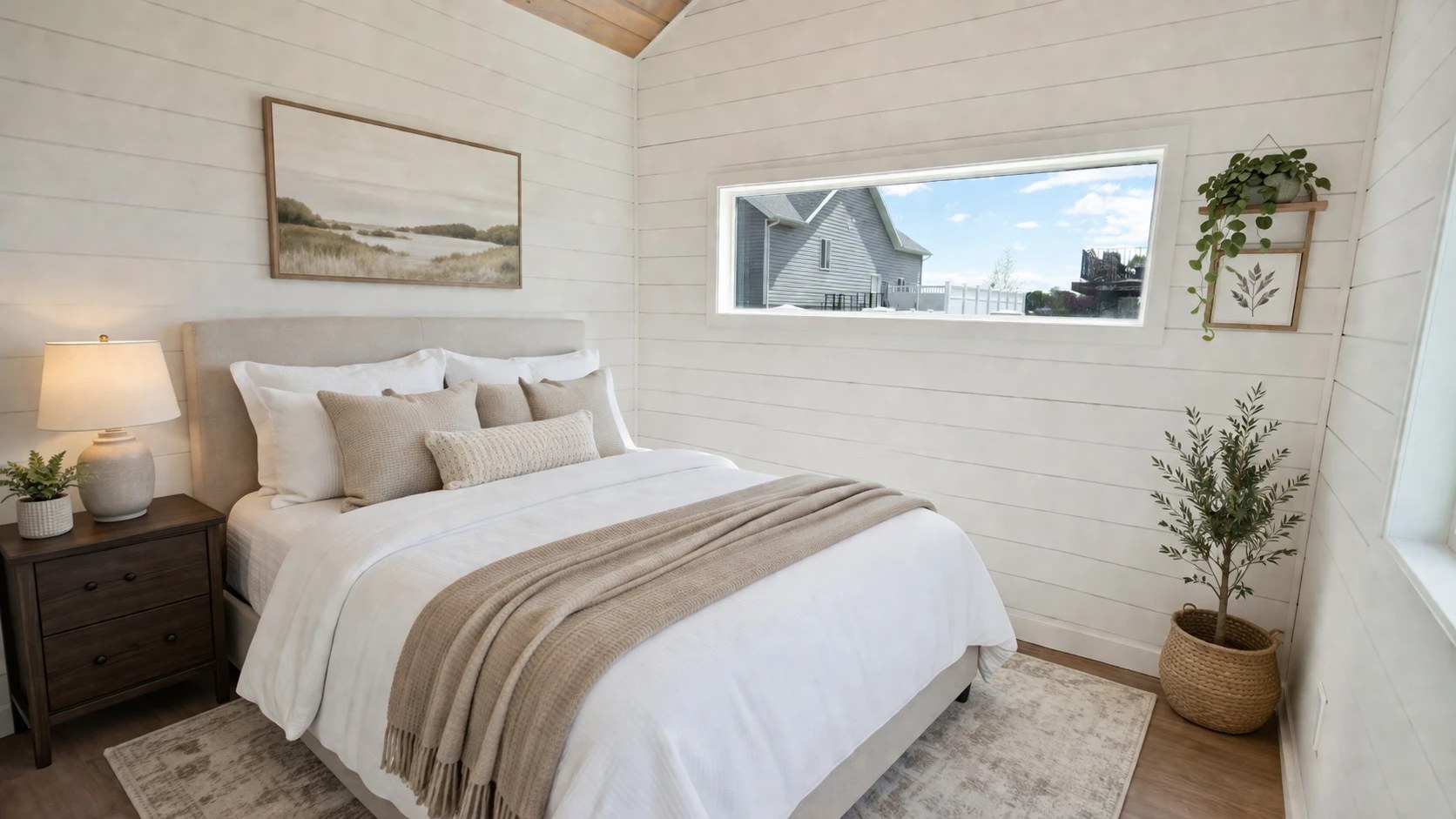 Bedroom inside a Cocoon ADU with a vaulted wood ceiling and mountain views