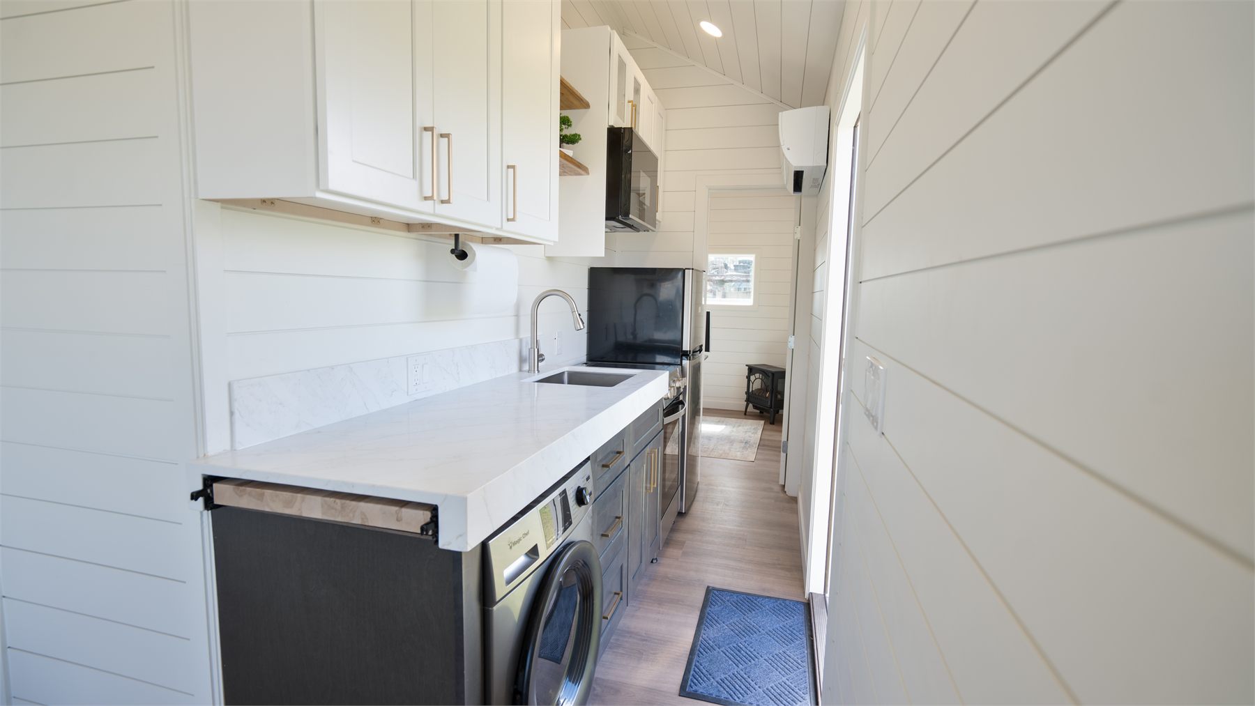 Full kitchen inside a Cocoon ADU with custom cabinetry and stainless appliances